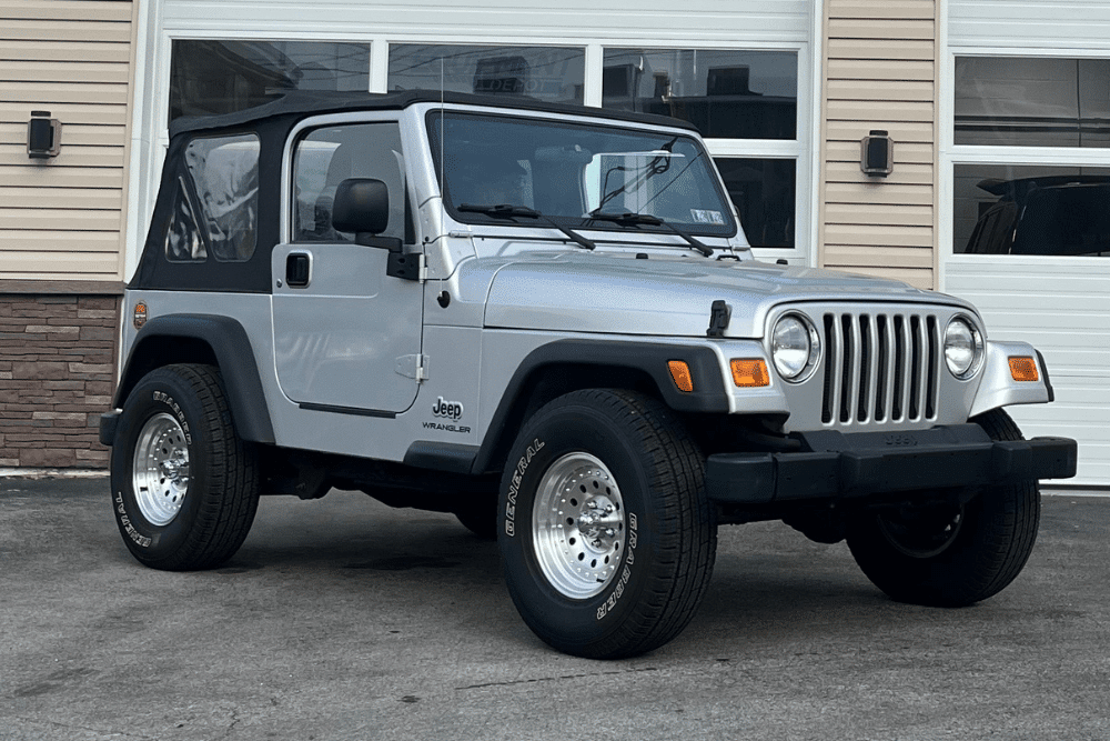 oil leak, auto repair in Allentown, PA at Allied Automotive. Silver Jeep Wrangler parked in front of an auto repair shop.