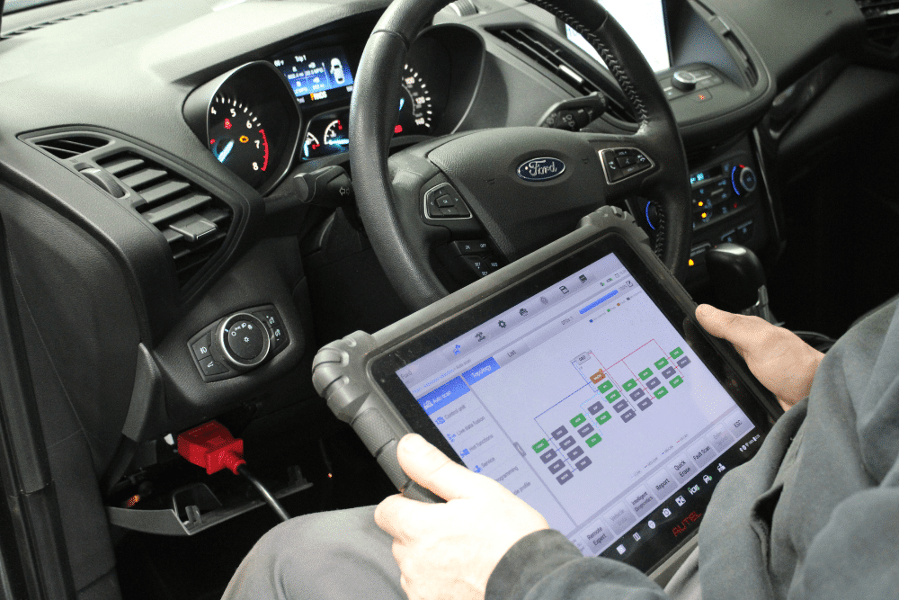 Vehicle diagnostics in Allentown, PA by Allied Automotive. Image of a technician using an advanced scan tool inside a Ford vehicle, highlighting the shop’s commitment to accurate troubleshooting, performance optimization, and reliable repairs.