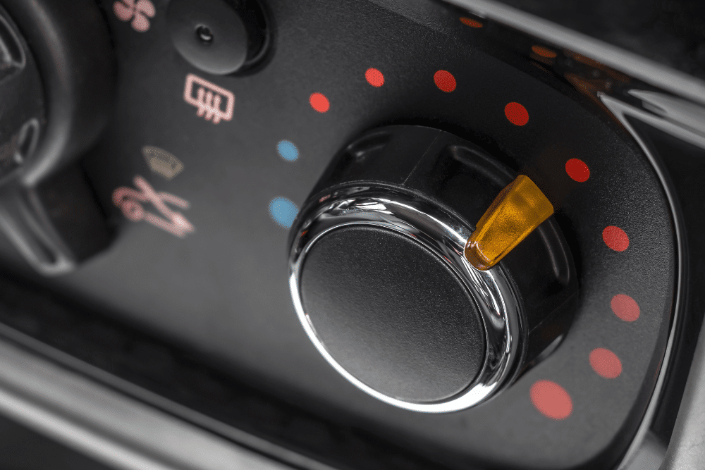 Car heater repair in Allentown, PA by Allied Automotive. Image of a vehicle’s climate control dial set to heat, symbolizing the importance of maintaining a reliable heating system for comfort and defrosting during Pennsylvania’s colder months.