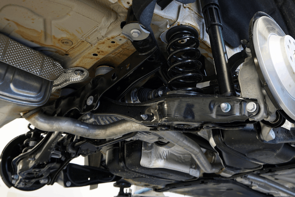 Steering and suspension repair in Allentown, PA by Allied Automotive. Image of undercar suspension components, including shocks, springs, and control arms, highlighting precision service to improve ride comfort, handling, and overall vehicle safety.