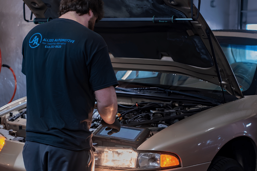 PA State Inspection in Allentown PA at Allied Automotive. Mechanic performing a PA state safety inspection using a diagnostic scan tool