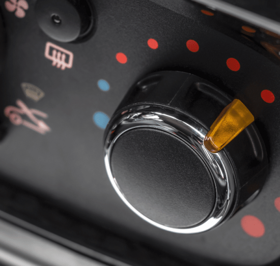 Car heater repair in Allentown, PA by Allied Automotive. Image of a vehicle’s climate control dial set to heat, symbolizing the importance of maintaining a reliable heating system for comfort and defrosting during Pennsylvania’s colder months.