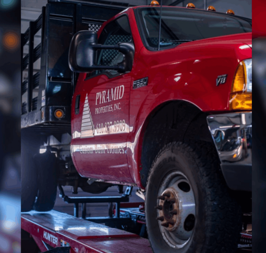 Fleet Services in Allentown, PA by Allied Automotive. Image of a commercial work truck on a lift, highlighting reliable diagnostics, maintenance, and repair services to keep fleet vehicles running efficiently and minimize downtime.