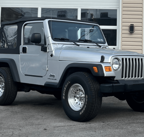 oil leak, auto repair in Allentown, PA at Allied Automotive. Silver Jeep Wrangler parked in front of an auto repair shop.