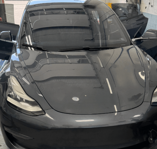 Tesla repair, auto repair in Allentown, PA by Allied Automotive. Image of a Tesla vehicle in a professional shop setting, highlighting advanced diagnostics, system checks, and specialized maintenance for modern electric vehicles.